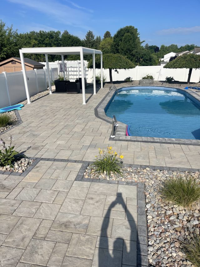 outdoor living spaces, patio design, paver driveways, stamped concrete patios, backyard hardscapes, walkway installation,