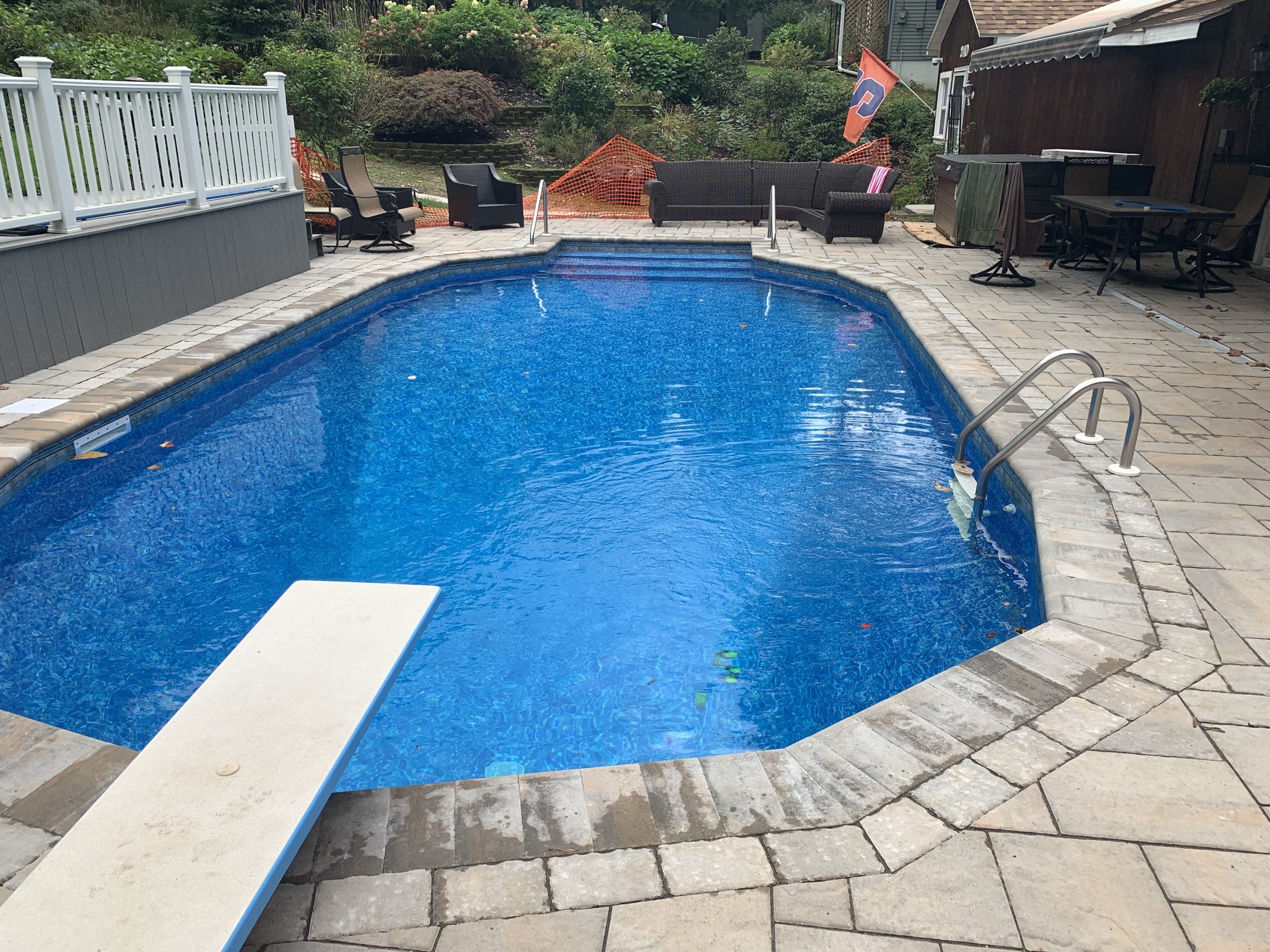 After: slip resistant concrete paver pool deck installed by Ground Force Property Services in Central New York