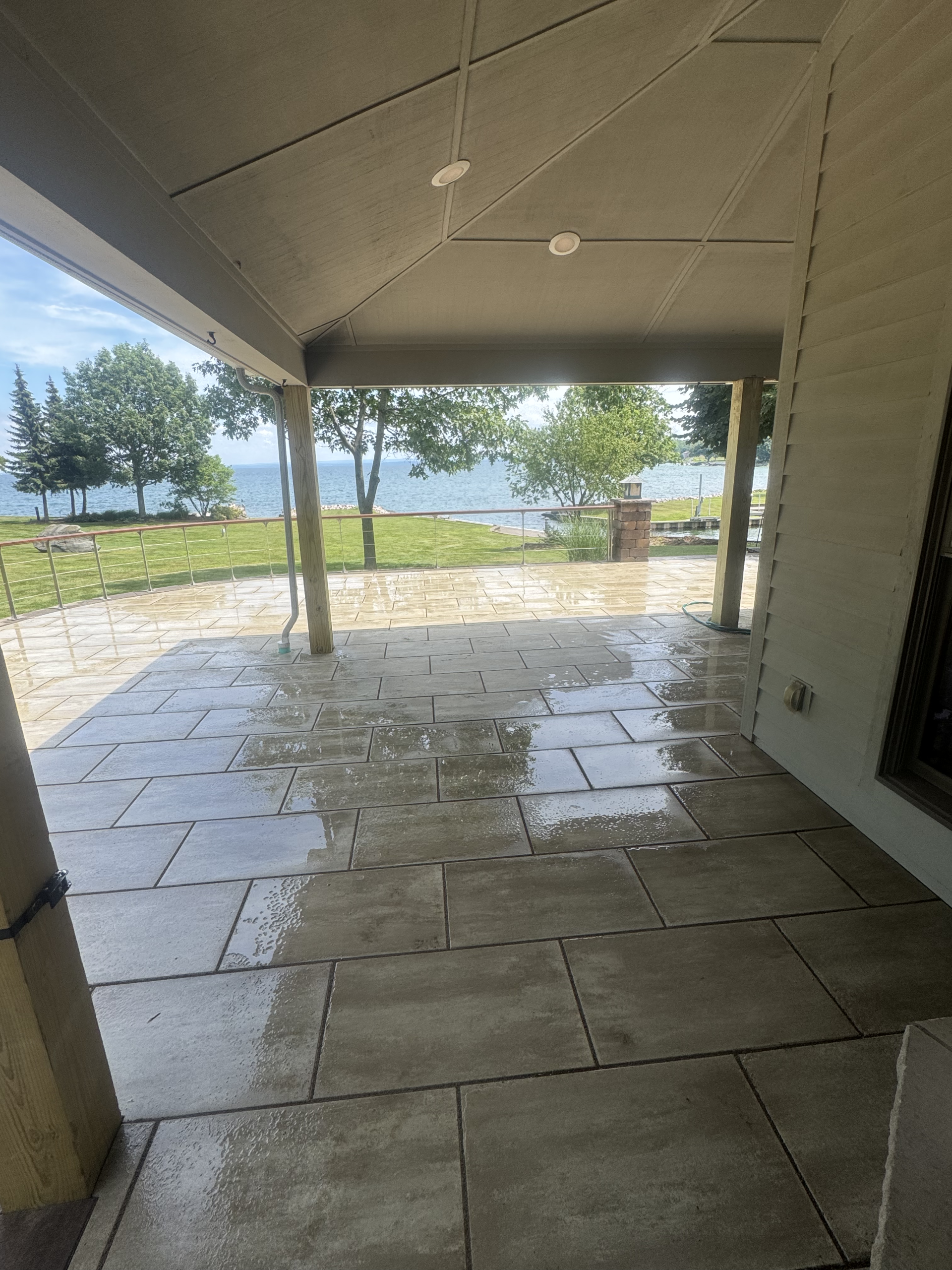 Techo-Bloc Grande paver patio transformation replacing an old wood deck in Central New York